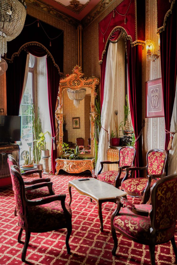 Elegant vintage hotel room in Istanbul featuring ornate decor and luxurious furnishings.